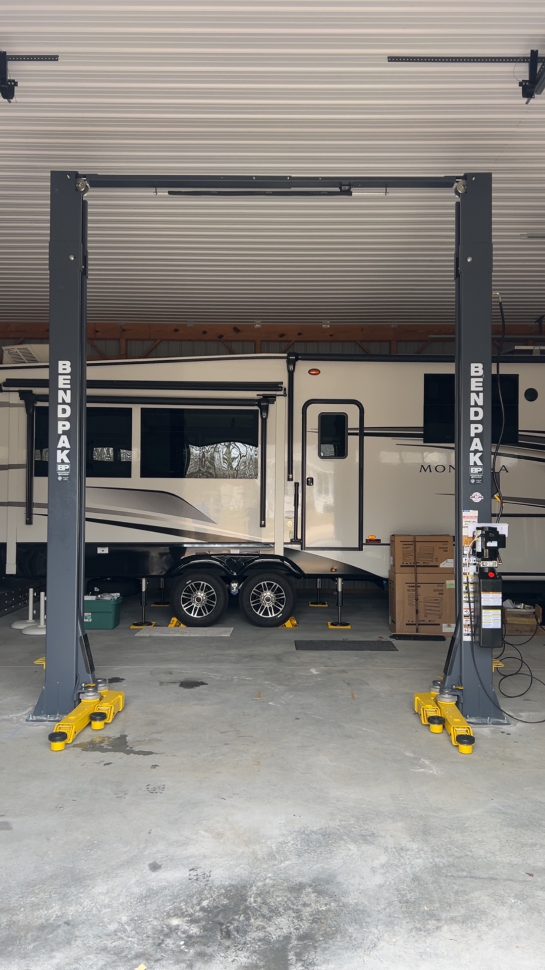 BendPak two-post lift installed to service a fifth-wheel RV