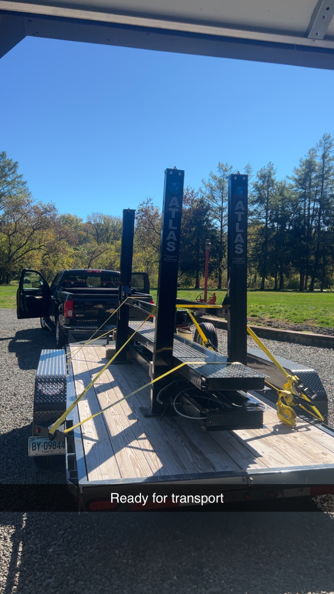 Atlas two-post lift strapped down and ready for transport