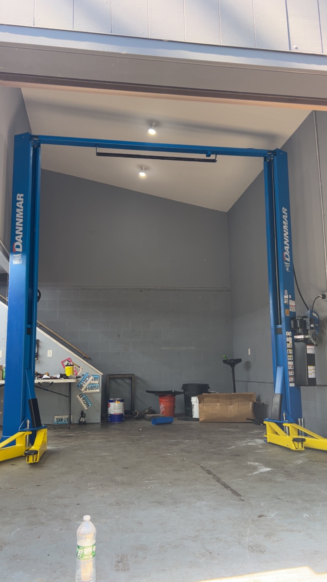 Dannmar two-post lift installed in a customer garage